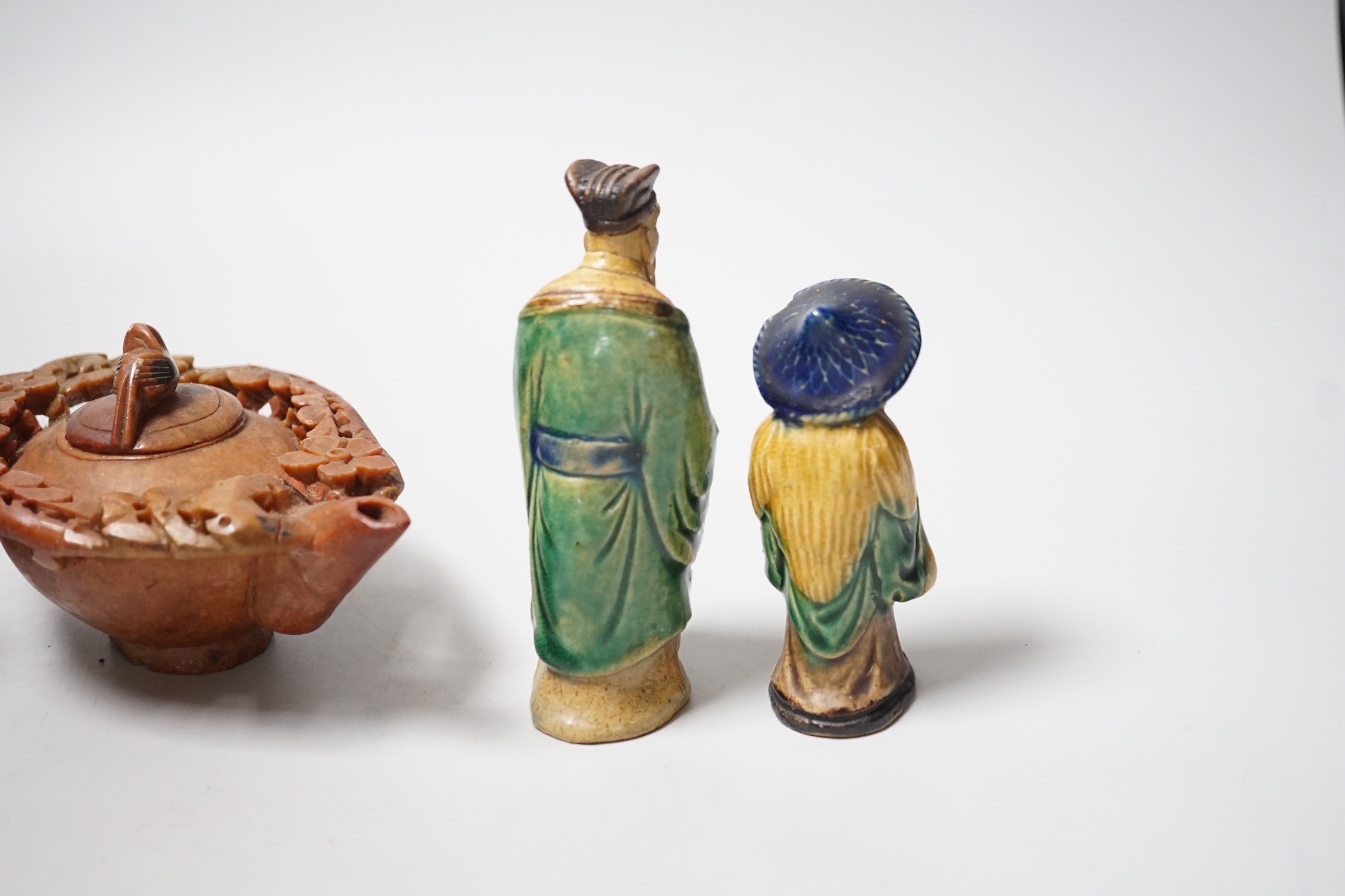 A Chinese carved soapstone pot, a terracotta teapot, and two earthenware figures, tallest figure 11cms high